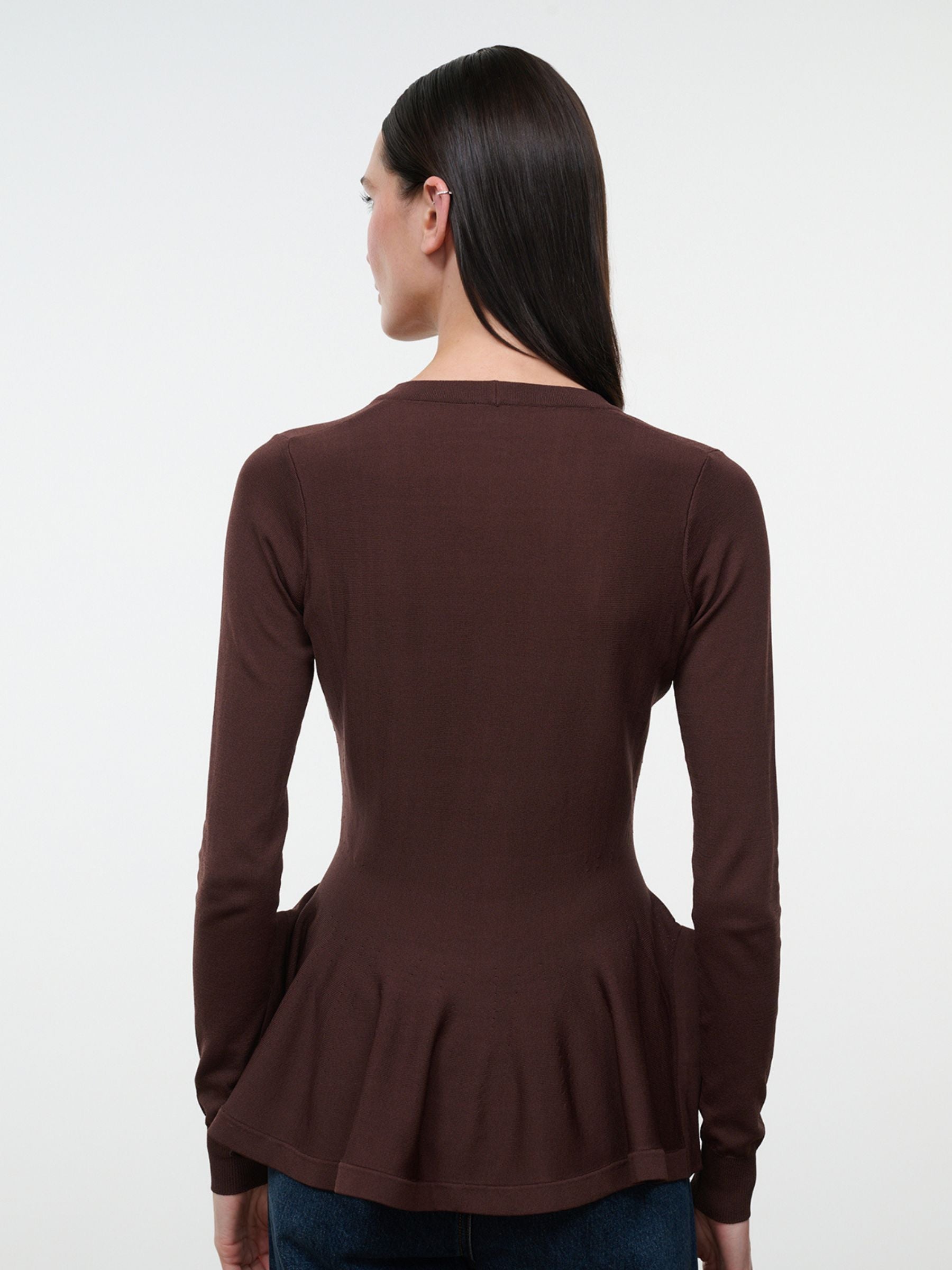 Staud Jamie Top in Earth on model, back view showing long sleeves and peplum hem