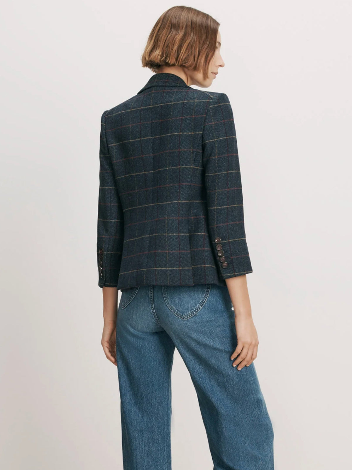 Back view of the Veronica Beard Schoolboy Teal Multi plaid jacket with cropped sleeves