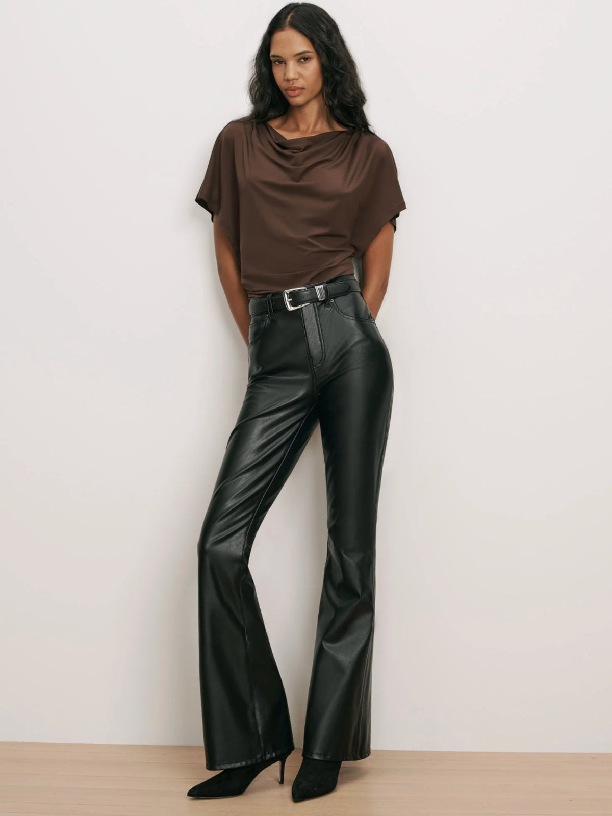 Veronica Beard Beverly black vegan leather pants styled with a brown top and belt