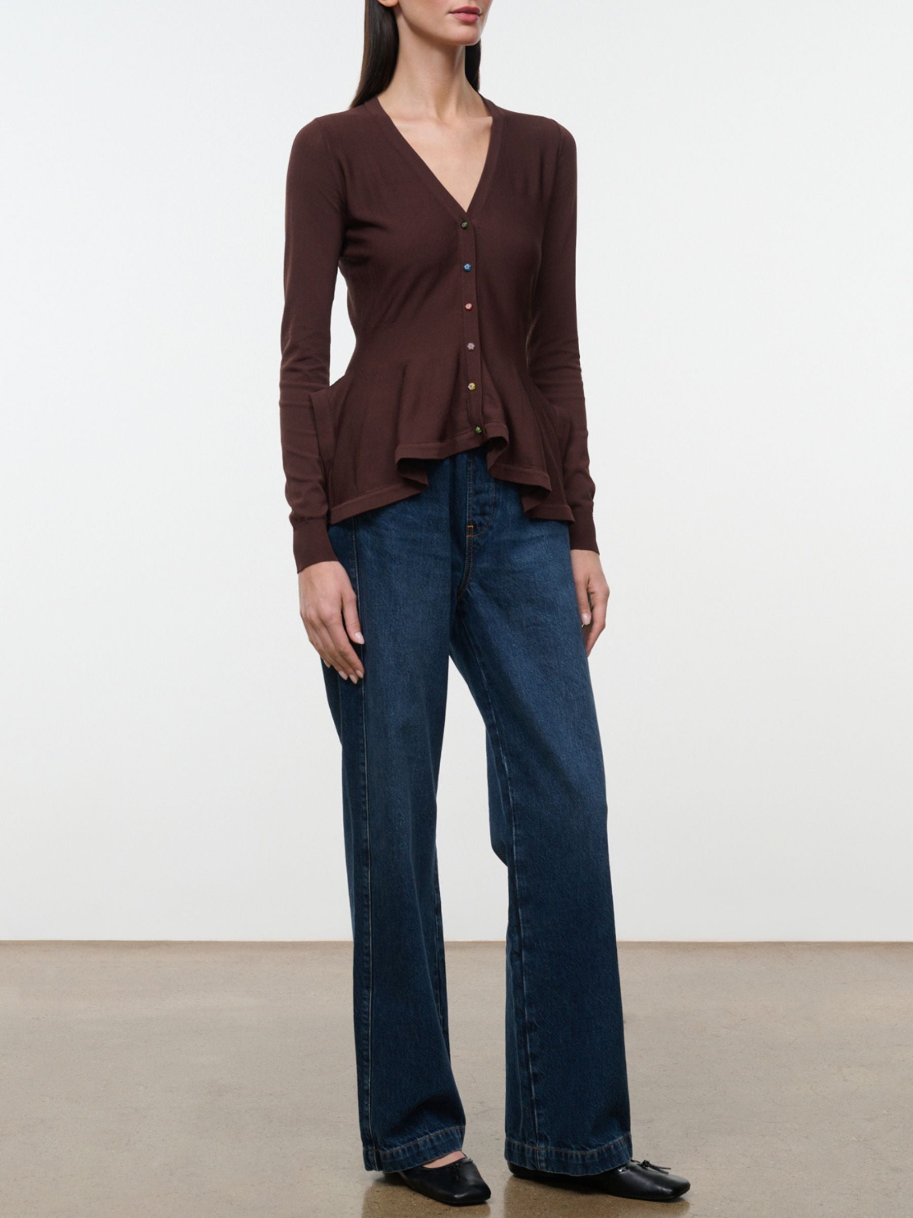 Full-length front view of model wearing Staud Jamie Top in Earth with jeans