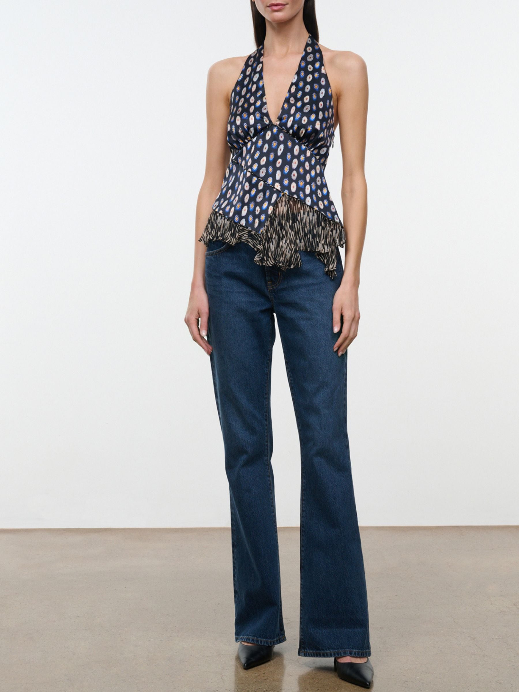 Full-length front view of model wearing Staud Maeva Silk Top in Glasswork Multi with jeans