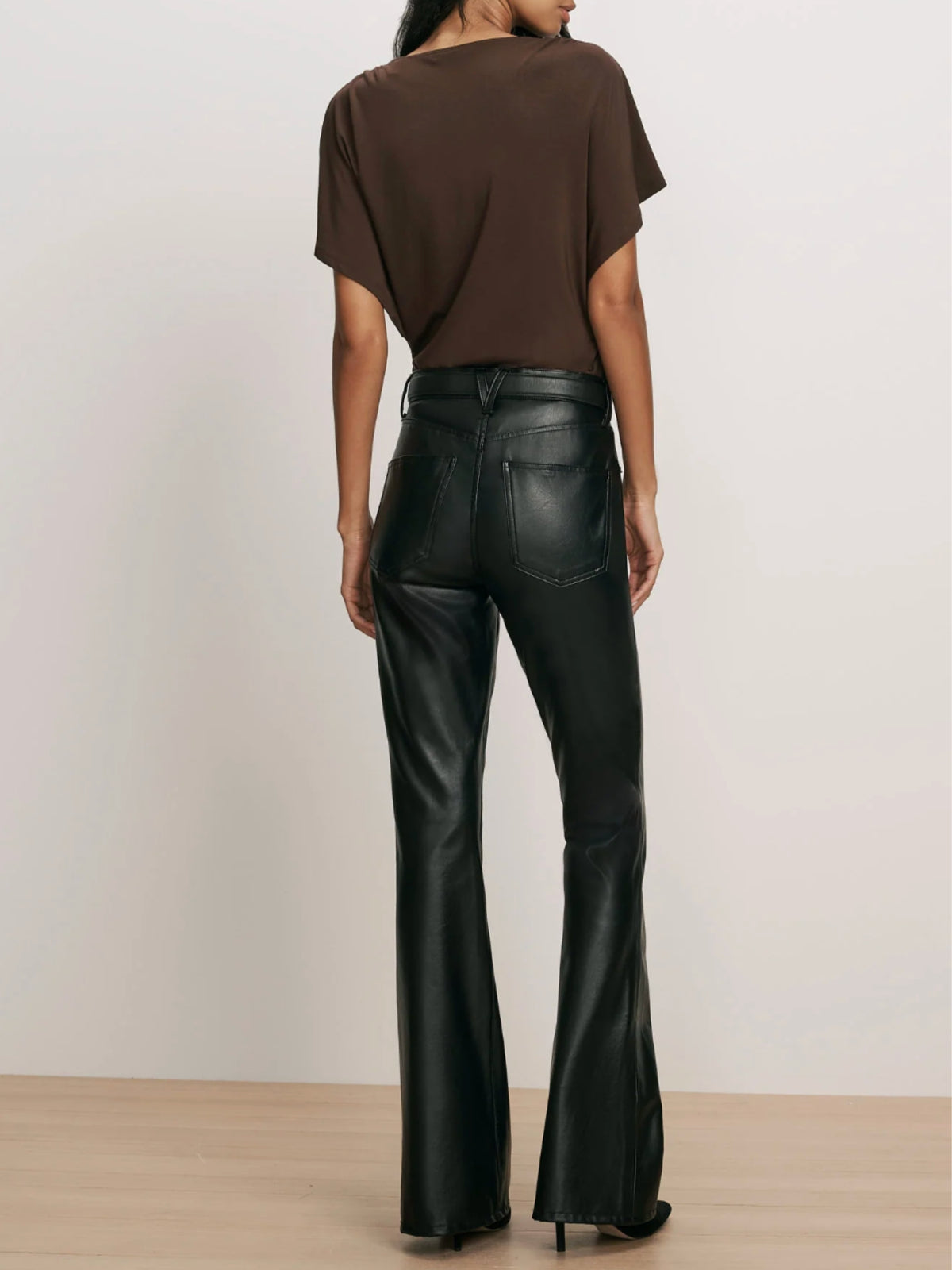 Back view of the Veronica Beard Beverly black pants, showing back pockets and flared legs