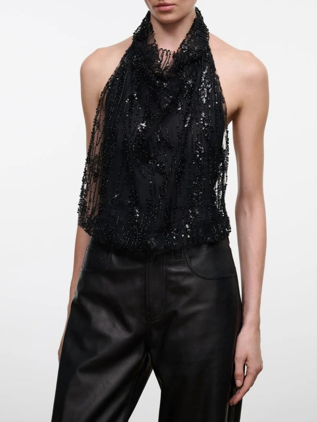 Close front view of the STAUD Monay Black Beaded bodysuit's draped neckline and beadwork