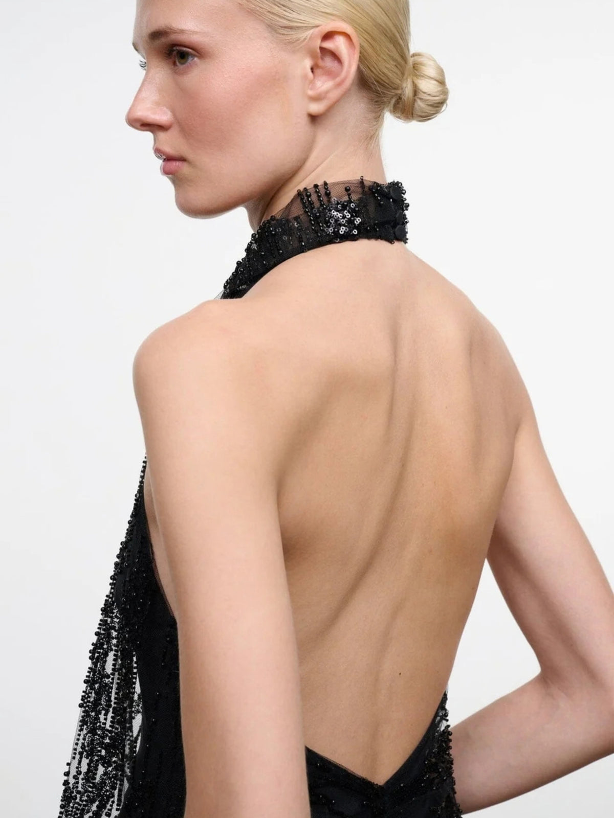 STAUD Monay Black Beaded bodysuit, close side-back view showing the halter neck and open back