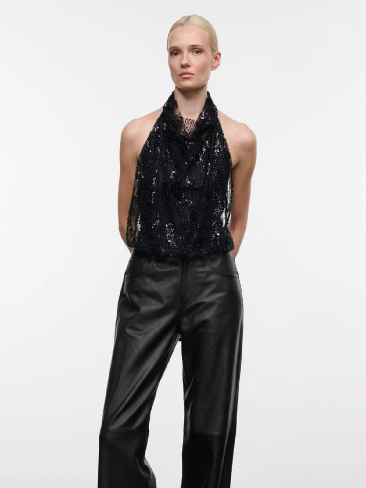 STAUD Monay Black Beaded bodysuit, front view with hands behind the back