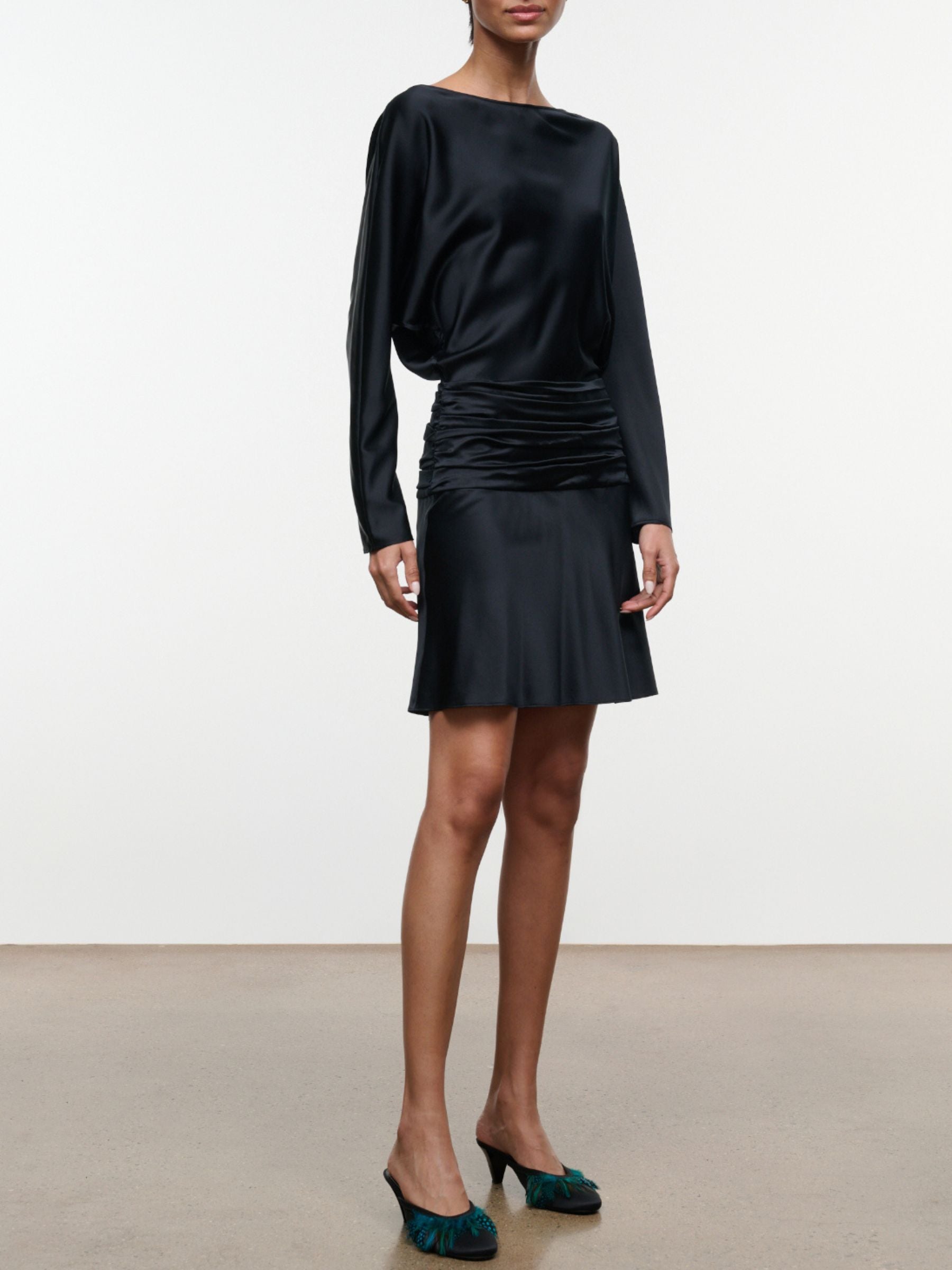 Full-length front view of black Staud Freda Silk Mini Dress on model
