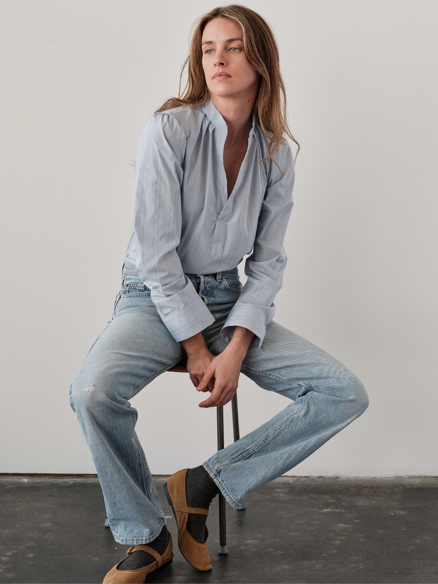 Cissa The Puff Shirt in Silver Lurex Stripe on seated model with jeans, three-quarter front view