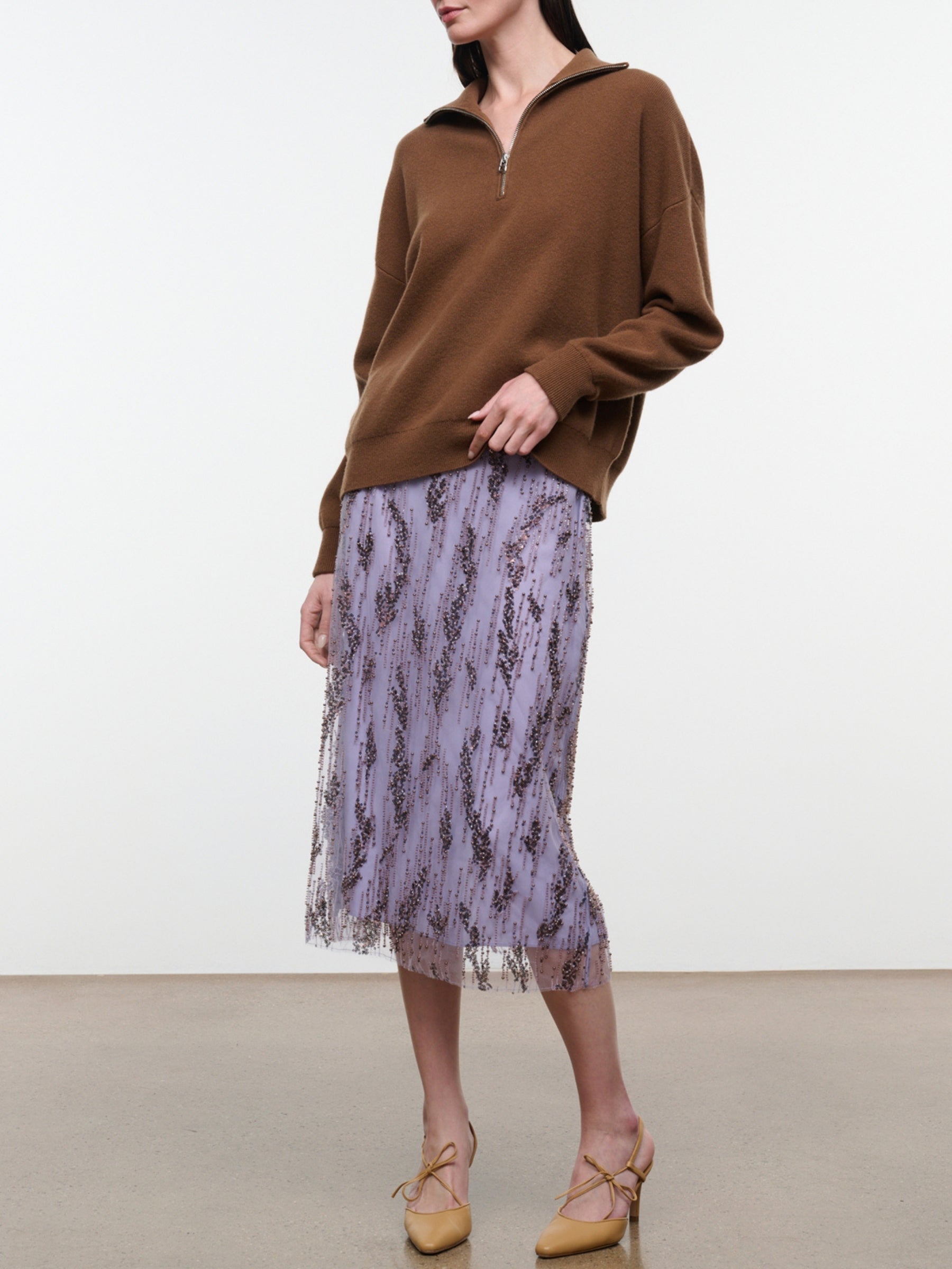 Model wearing the Staud Aviva Skirt in Lilac, front three-quarter view