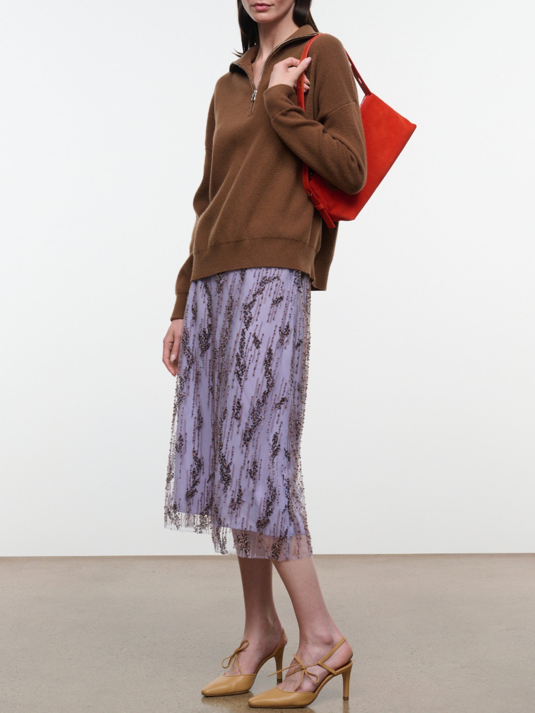 Model wearing the Staud Aviva Skirt in Lilac, side view