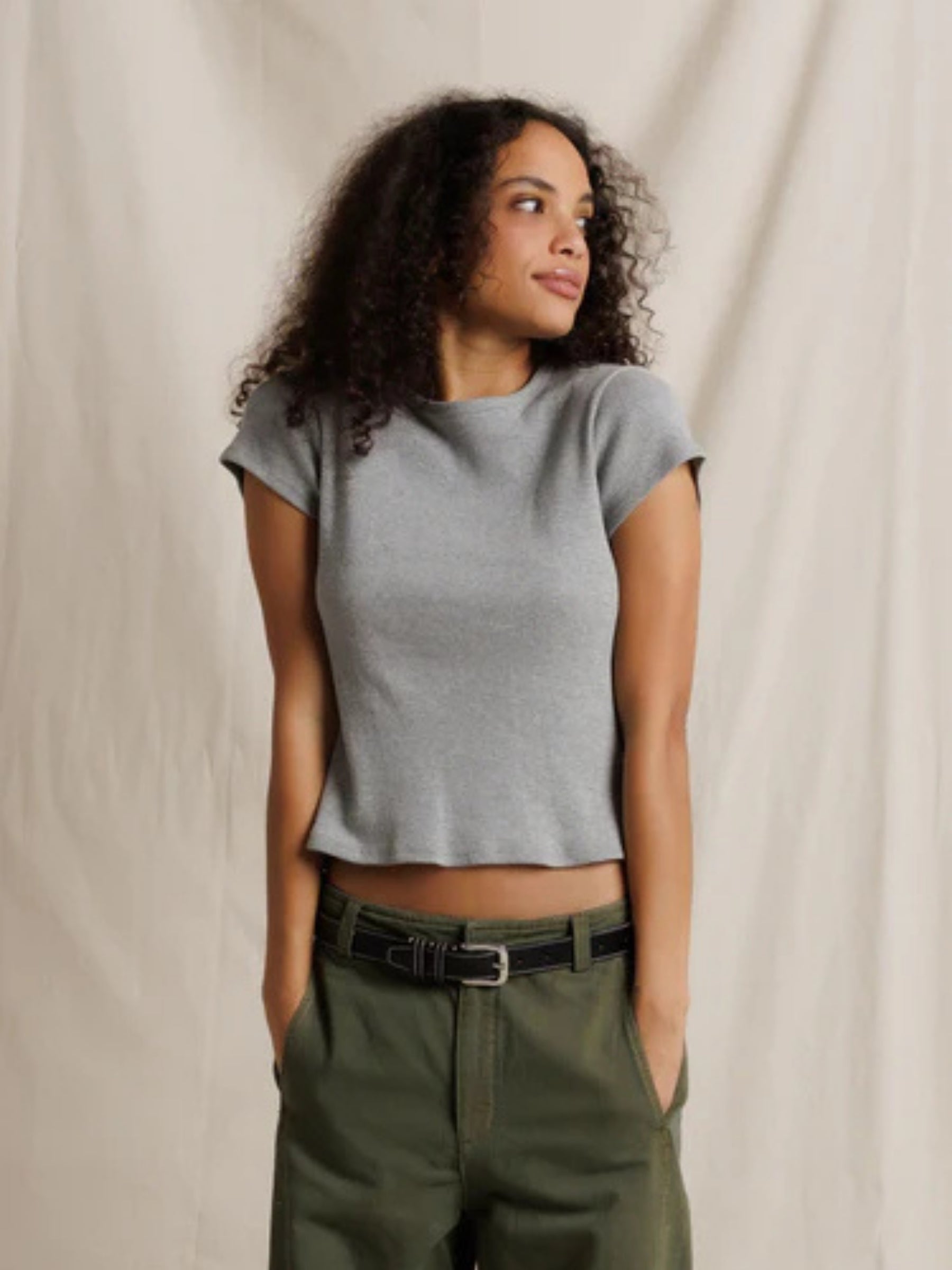 Model wearing the Perfect White Tee Macy Baby Tee in Heather Grey, front view