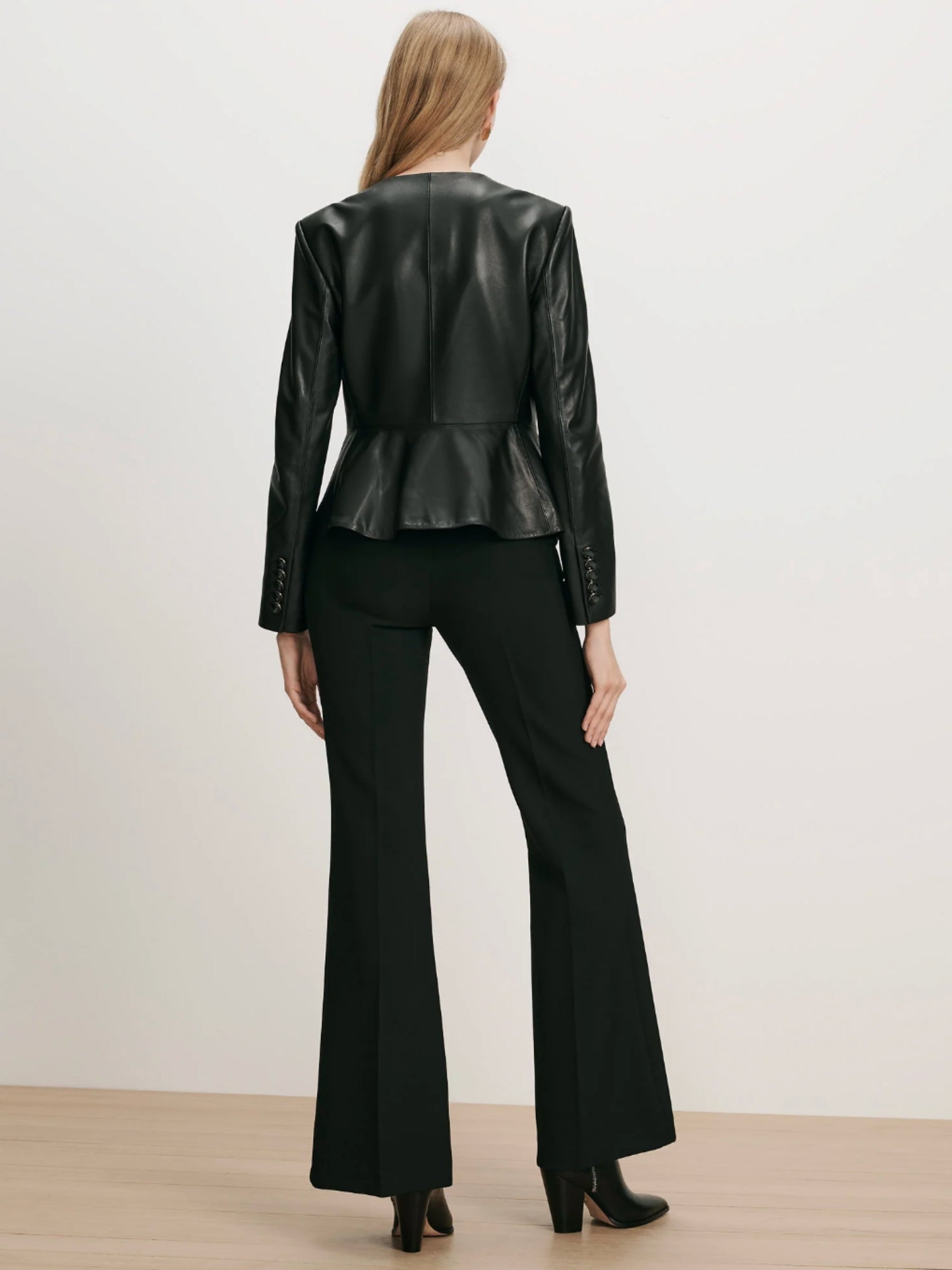 Veronica Beard Quinn Leather Peplum Jacket in Black on model, back view
